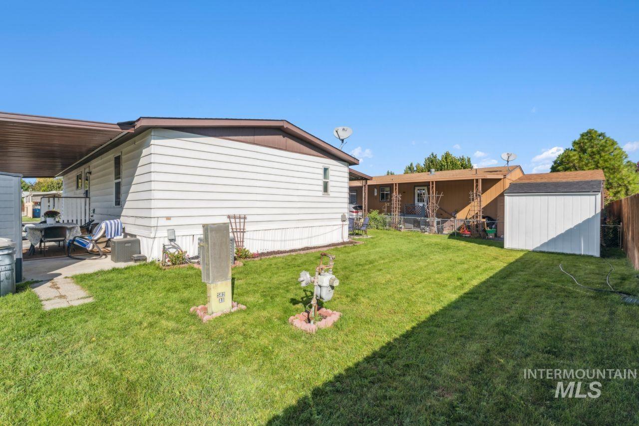 View of home's exterior featuring a shed and a central AC unit