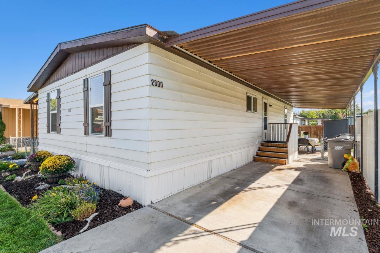 View of property exterior with a carport