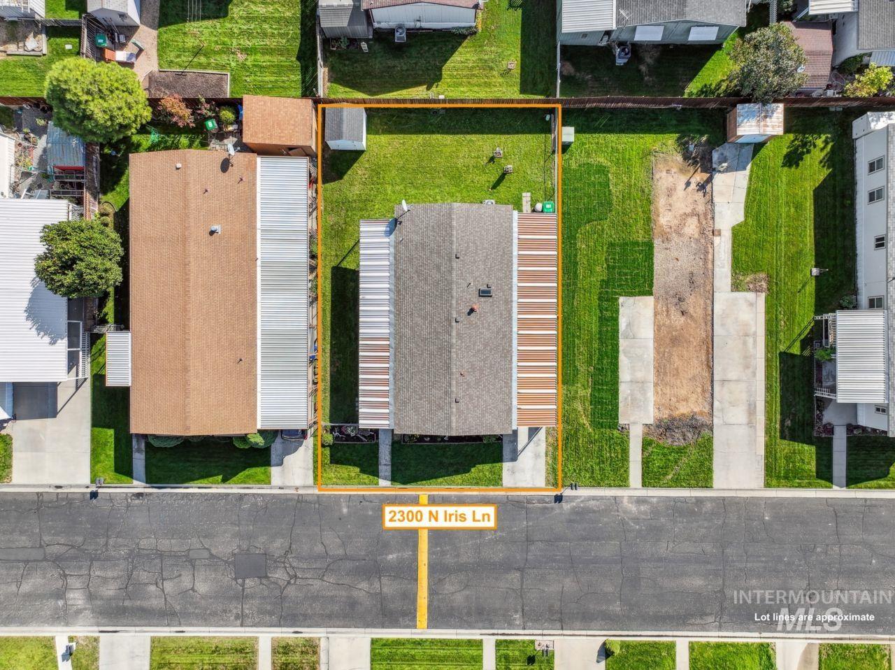 Aerial perspective of suburban area with property parcel outlined