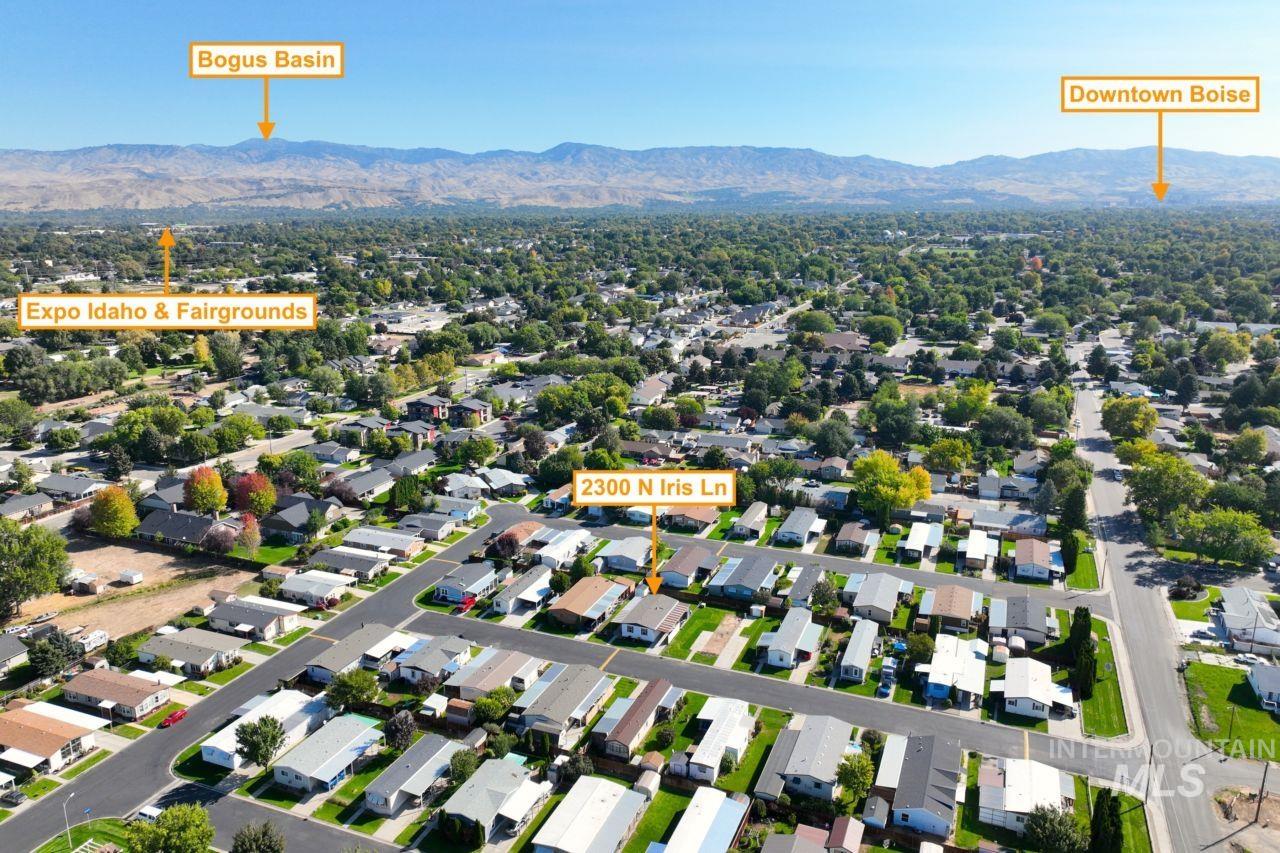 Aerial perspective of suburban area featuring a mountainous background