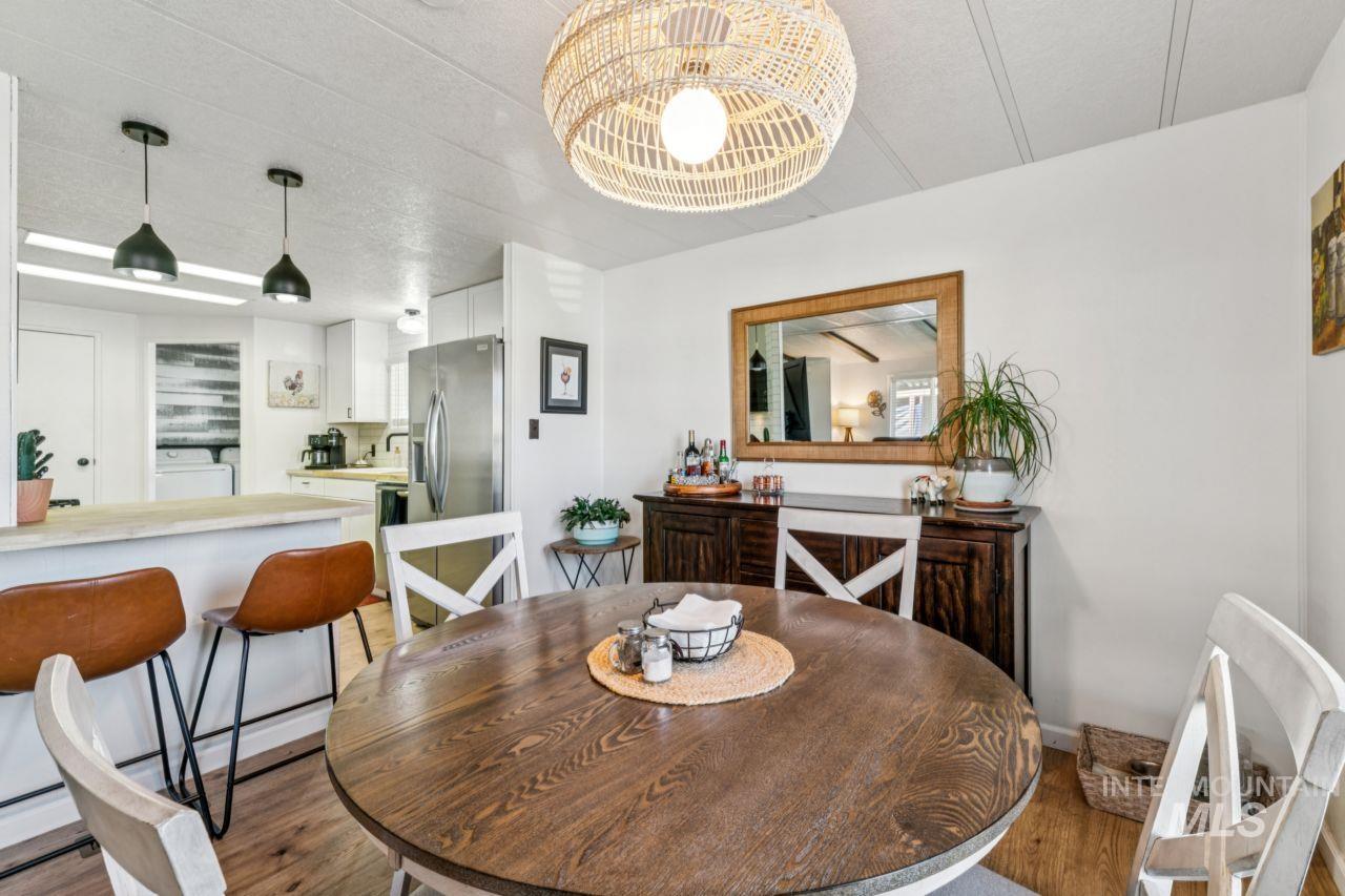 Dining room featuring wood finished floors and washer / clothes dryer