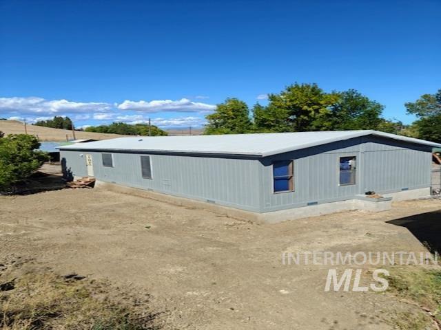 Back of property featuring crawl space