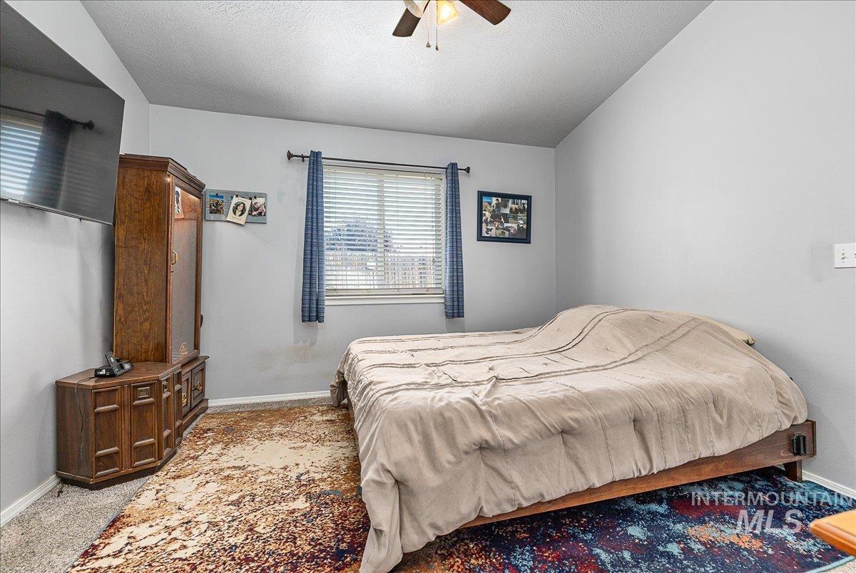 Primary bedroom with bath and walk-in closet.