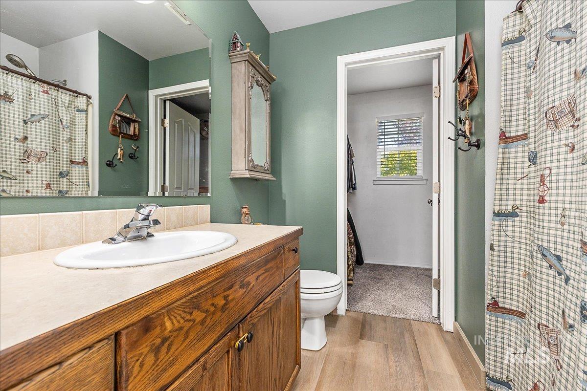 Walk-in closet offers plenty of space and a window!