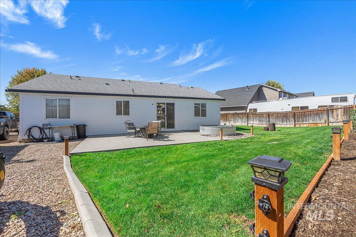 Large and fully fenced backyard with lots of grass space.