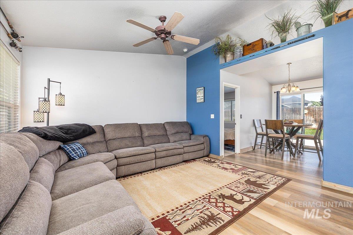 Living room with entrance to dining and kitchen areas. As you tour, notice all of the elevated accessory ledges within the home!