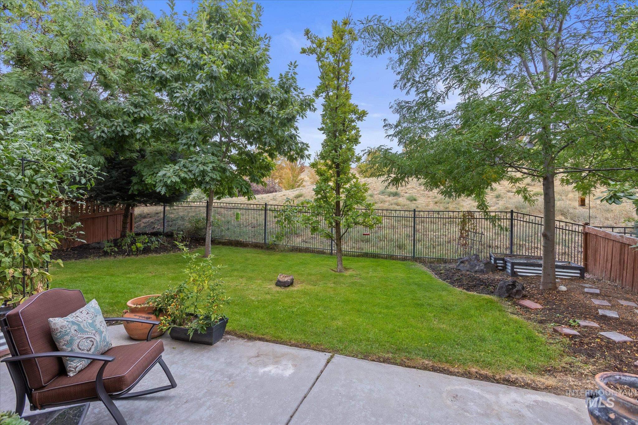 Fenced backyard featuring a patio