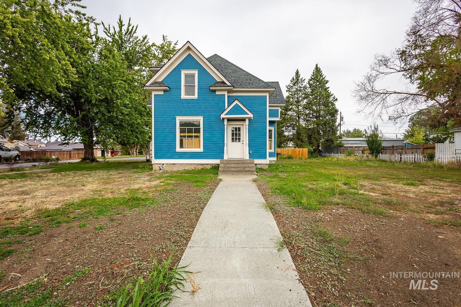 View of front of property featuring roof with shingles