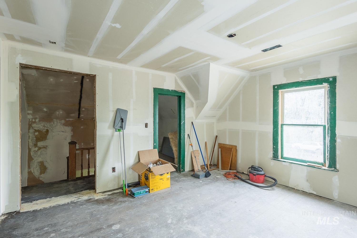 Additional living space featuring lofted ceiling