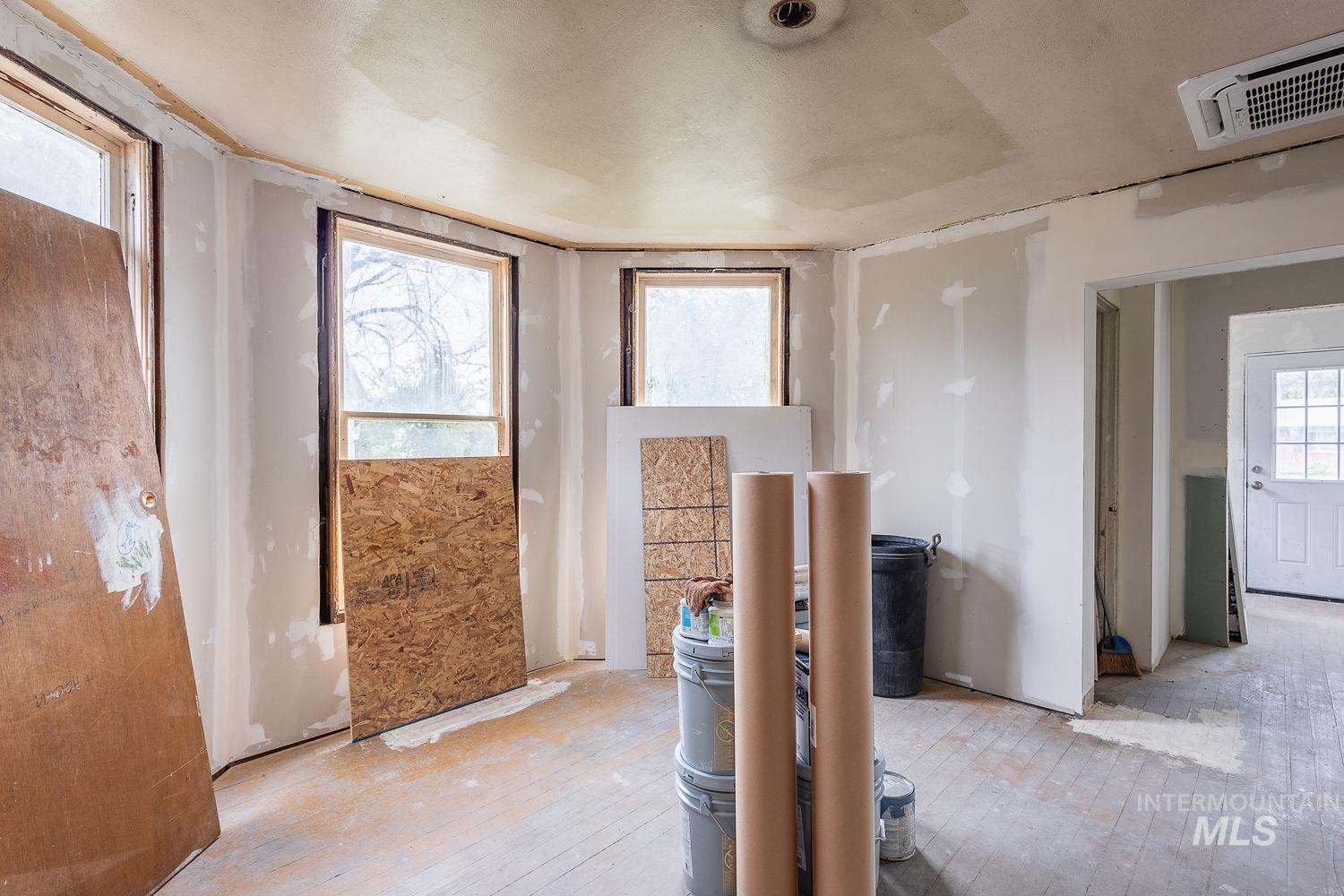 Miscellaneous room with hardwood / wood-style floors