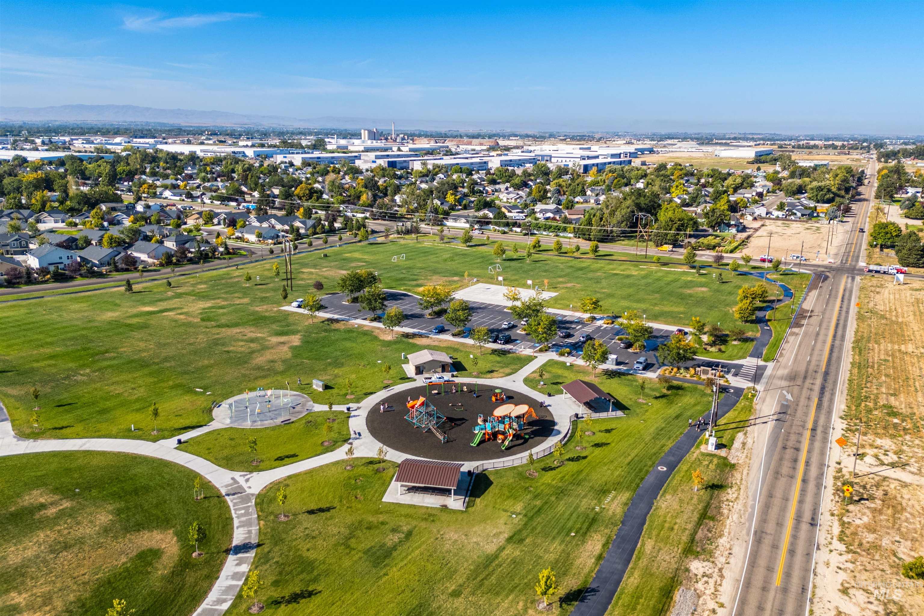Aerial overview of property's location with nearby suburban area and a recreational park