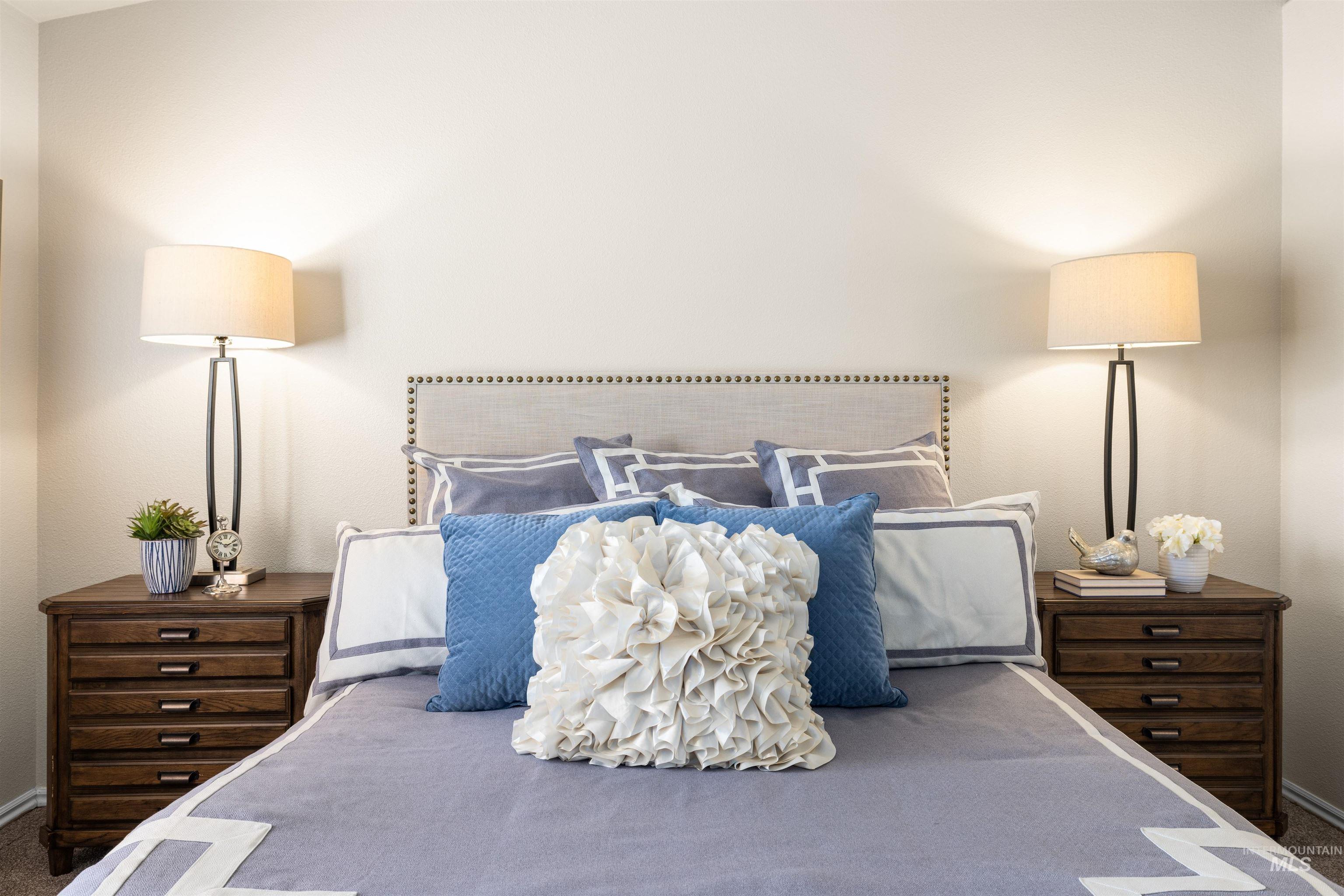 Carpeted bedroom with baseboards