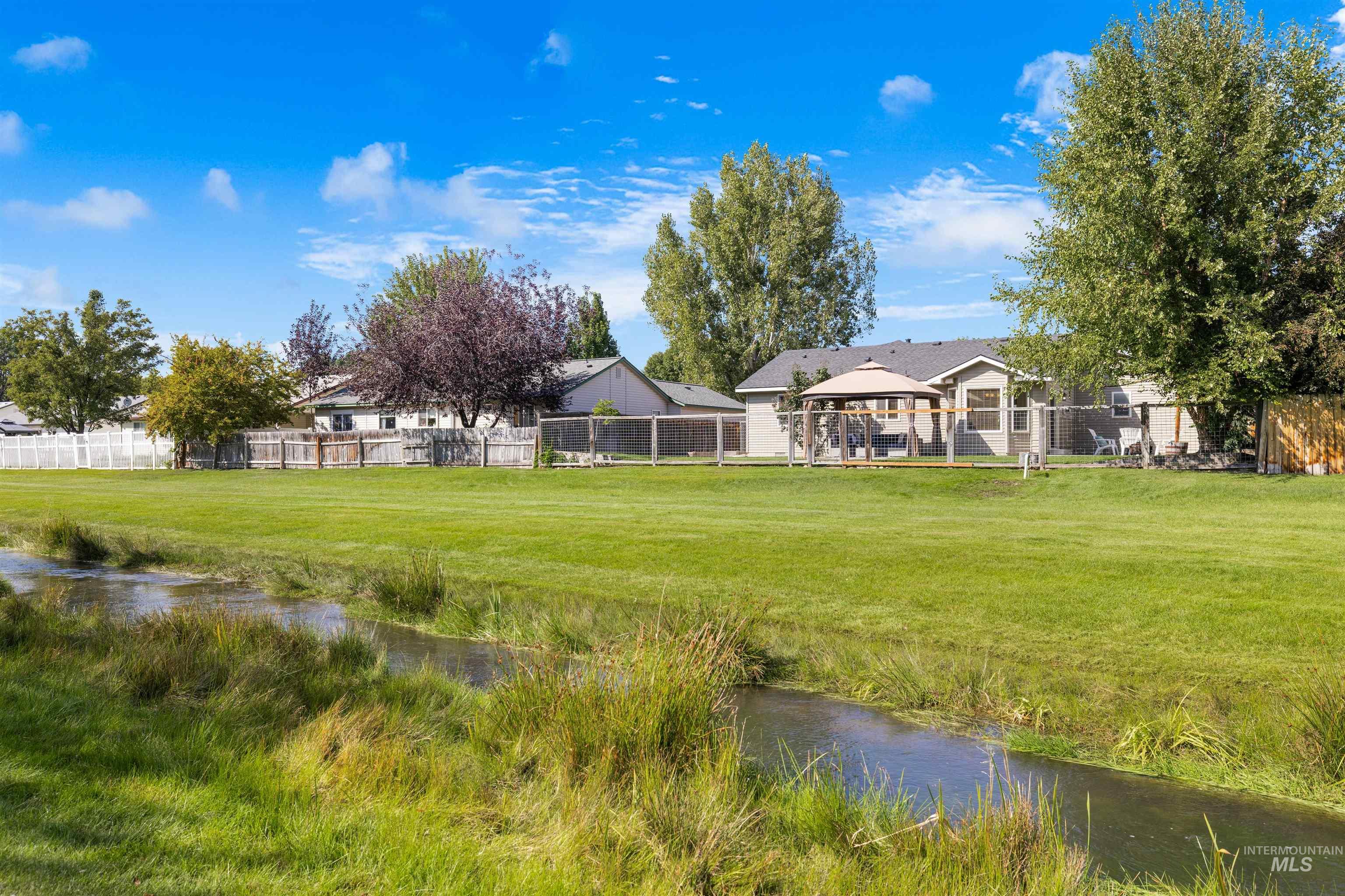 View of yard with a gazebo and a water view