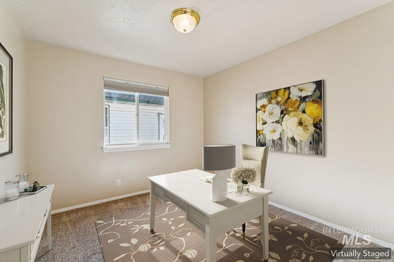 Carpeted office with baseboards