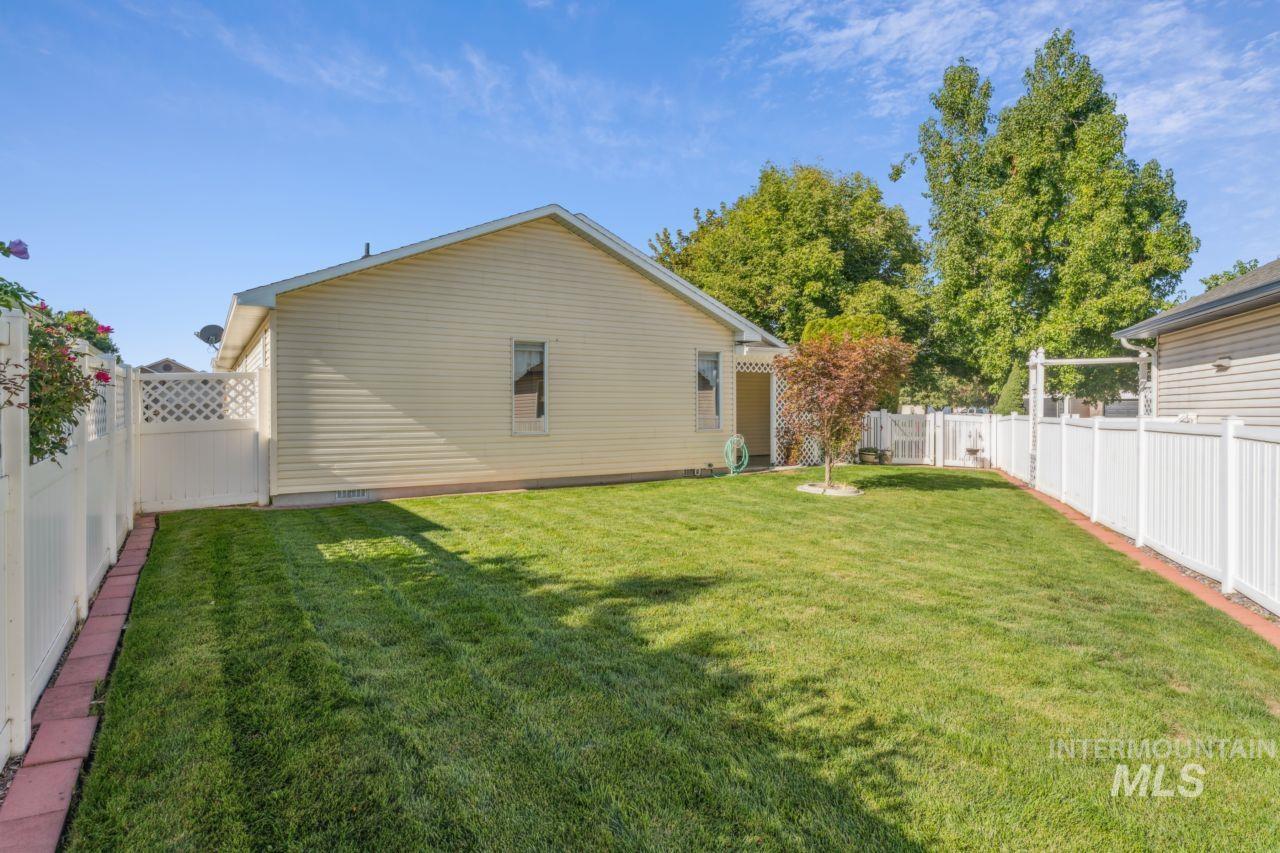 View of fenced backyard