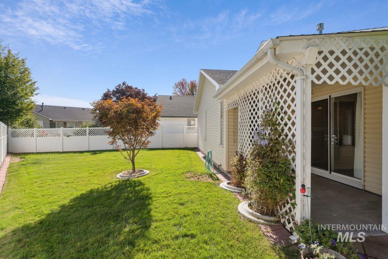 View of fenced backyard