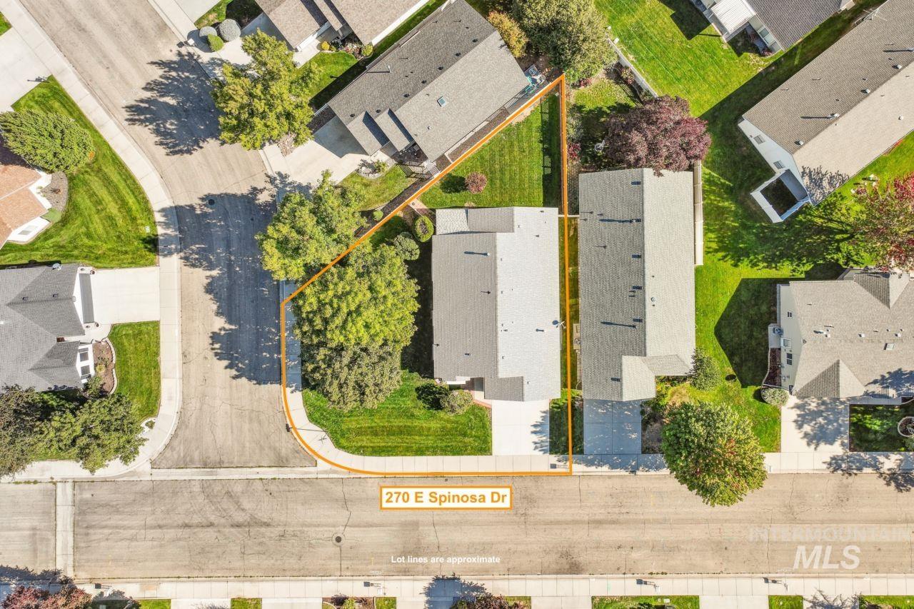 Aerial perspective of suburban area featuring property boundaries highlighted