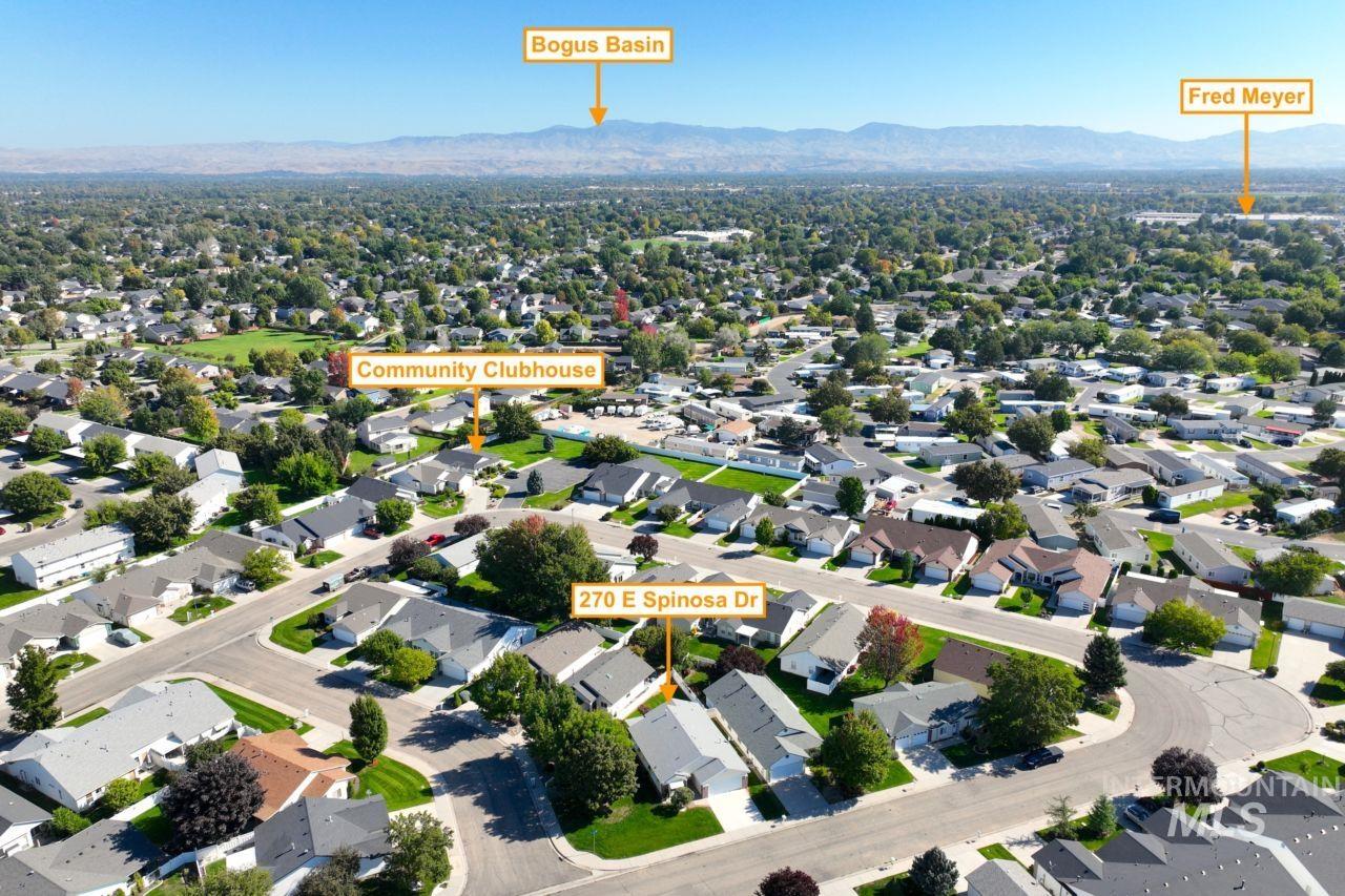 Aerial view of residential area with a mountainous background