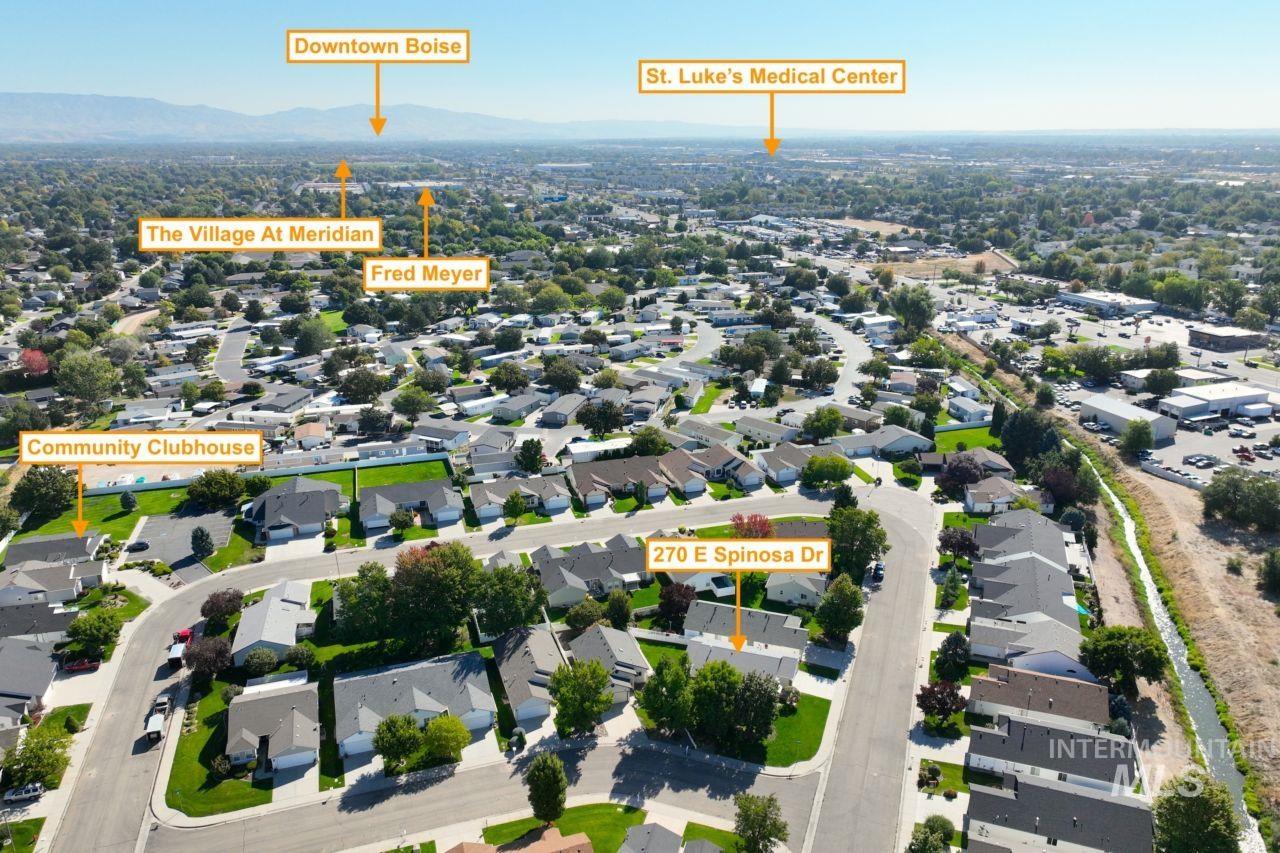 Aerial perspective of suburban area featuring mountains