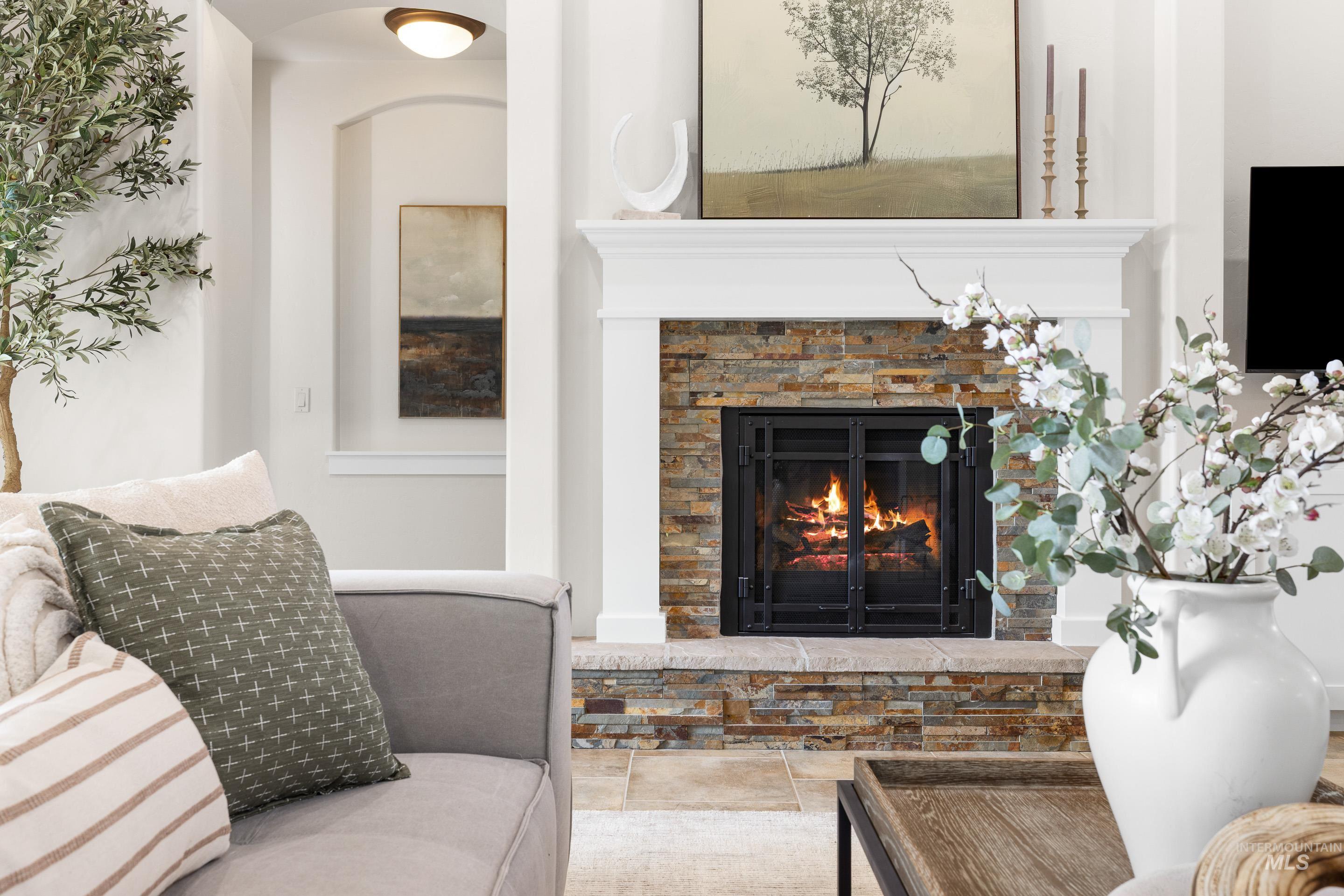 Living room with a glass covered fireplace