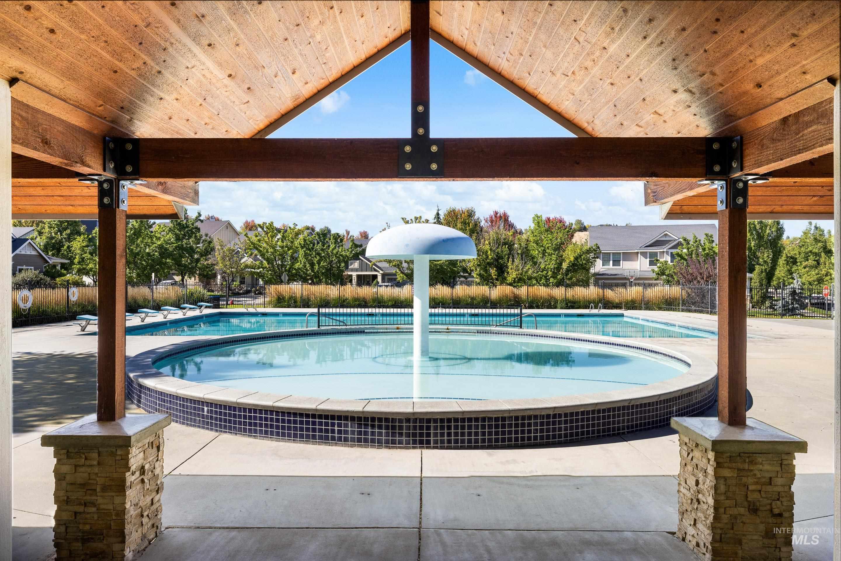 Community pool with a patio area