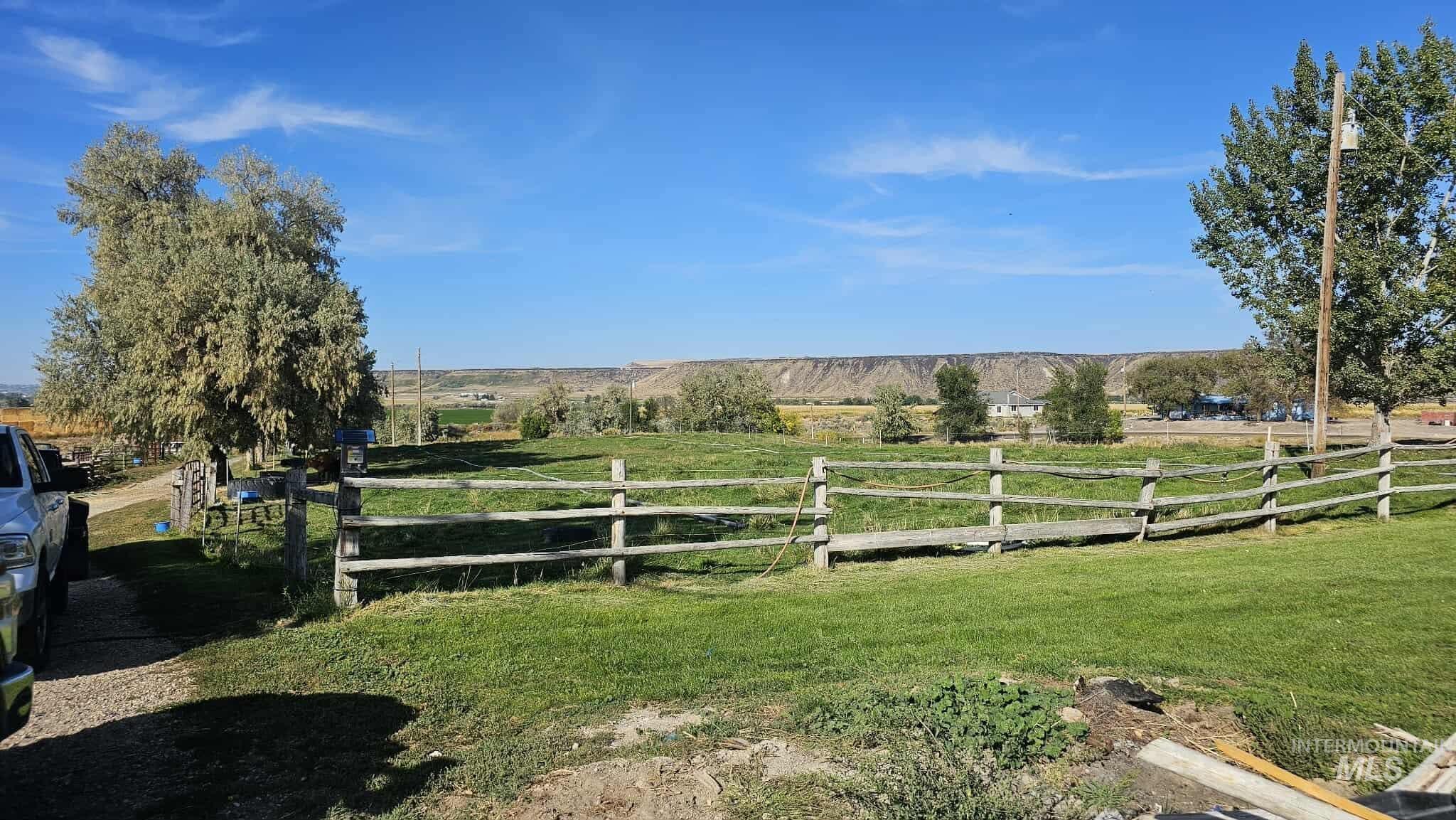 View of yard with a rural view