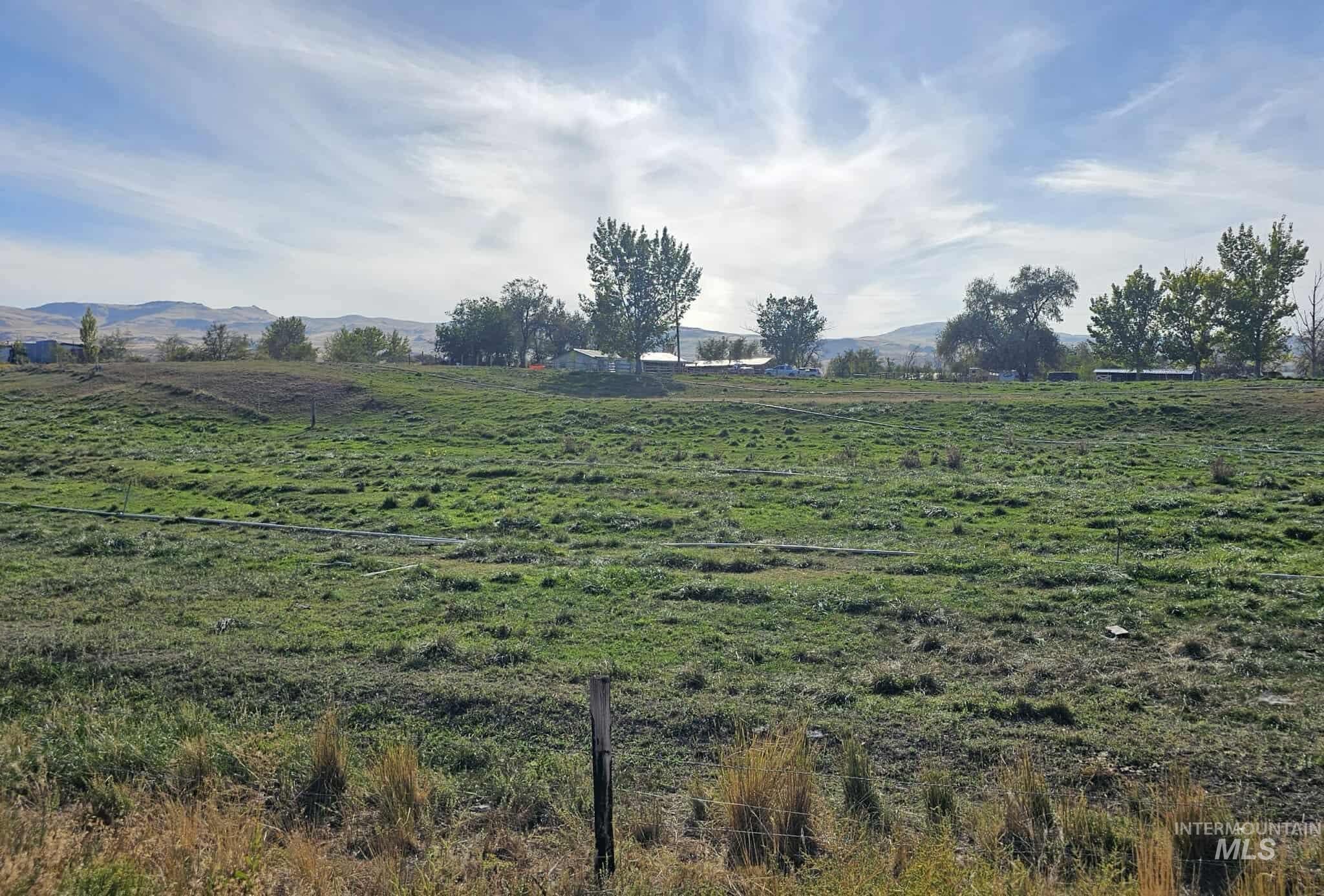 View of yard with a mountain view and a view of rural / pastoral area