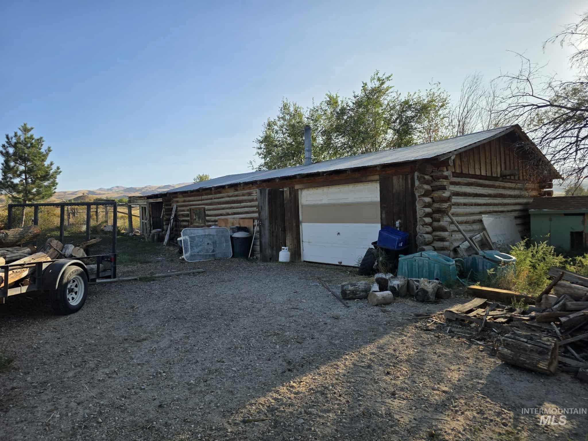 Garage featuring driveway and a mountain view