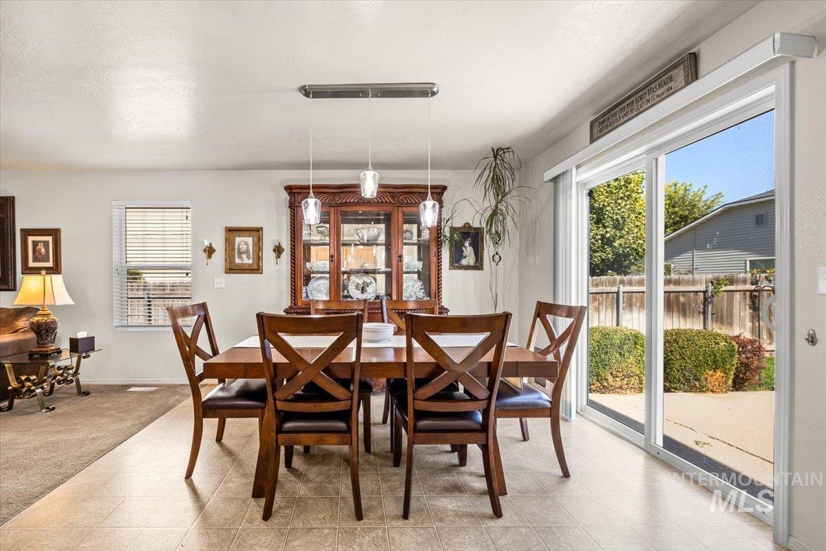 Dining area with sliding doors leading to the backyard.