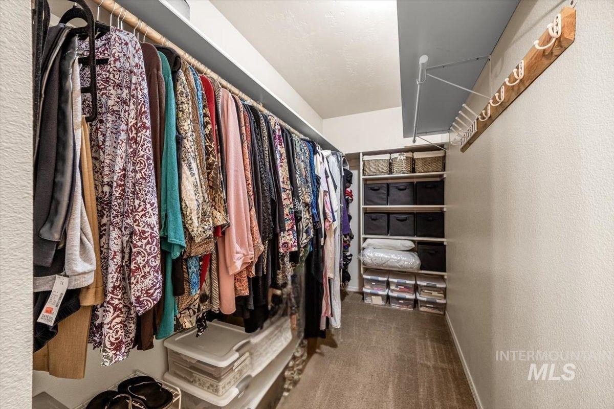 Walk-in closet with plenty of storage for all your needs.
