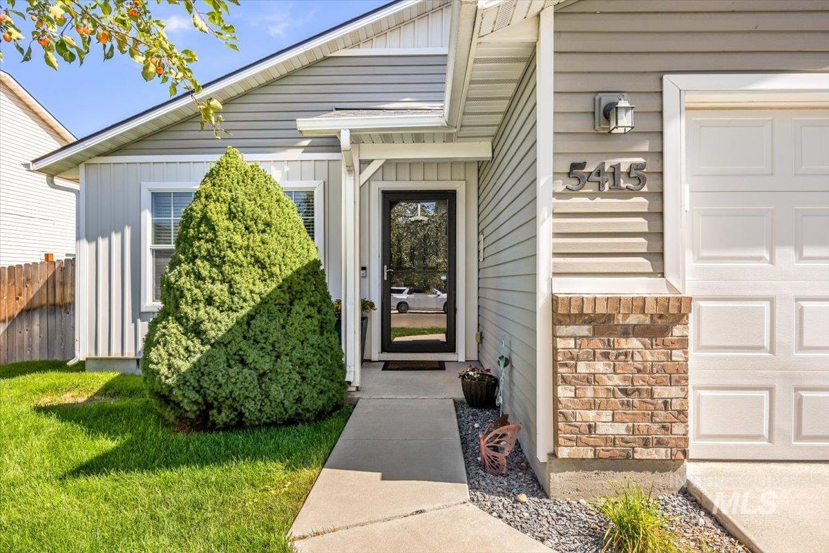 Inviting entryway with a cozy front porch.