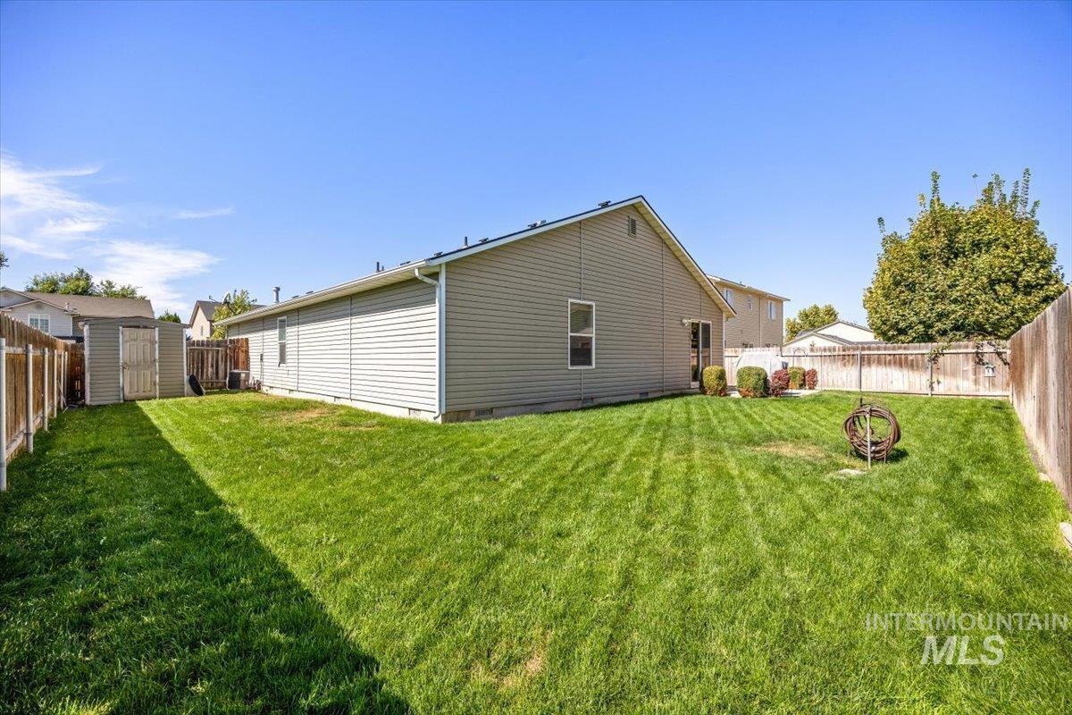 Lush green yard with plenty of space for gardening or play.