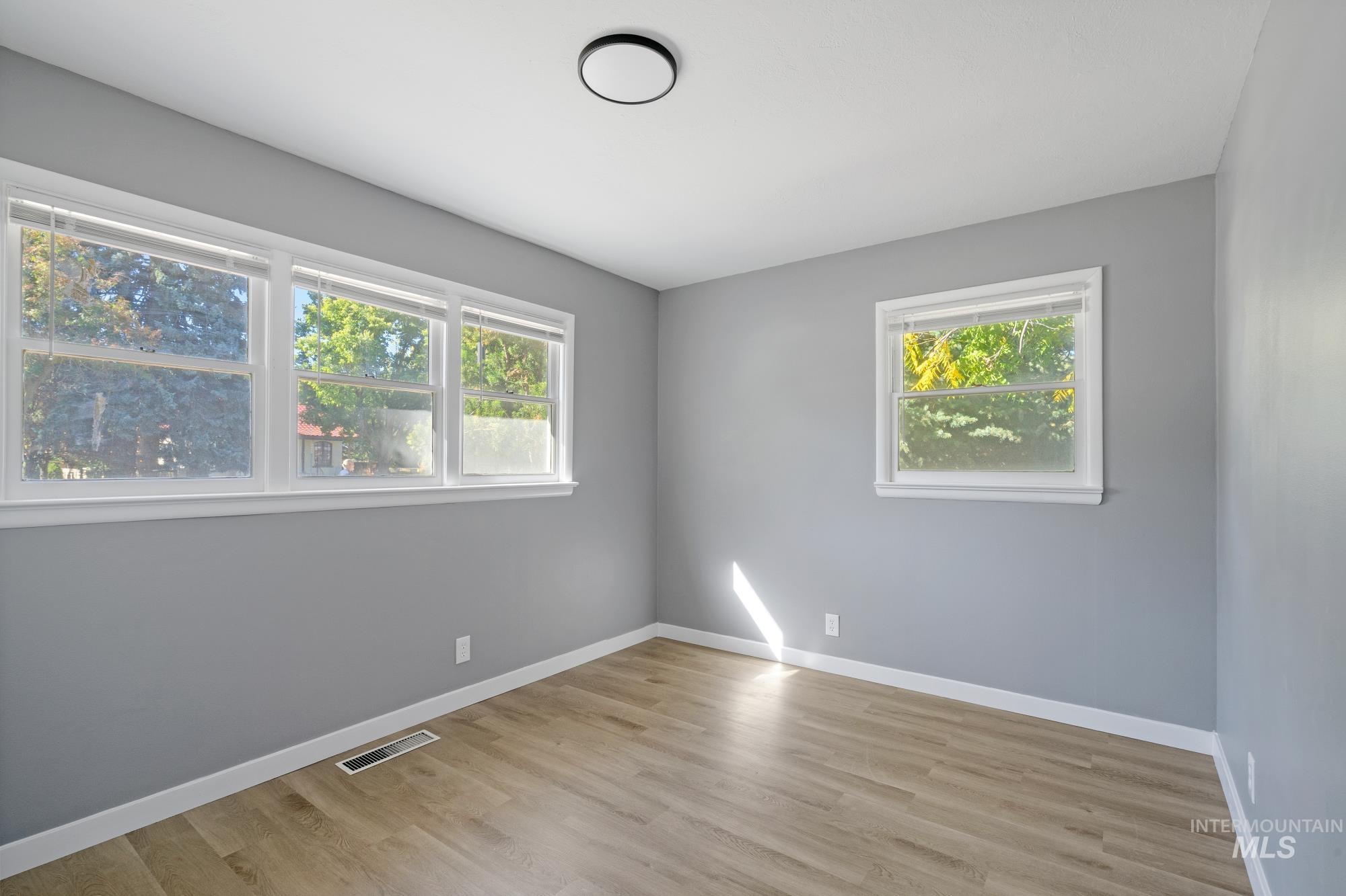 Empty room featuring light wood-style flooring