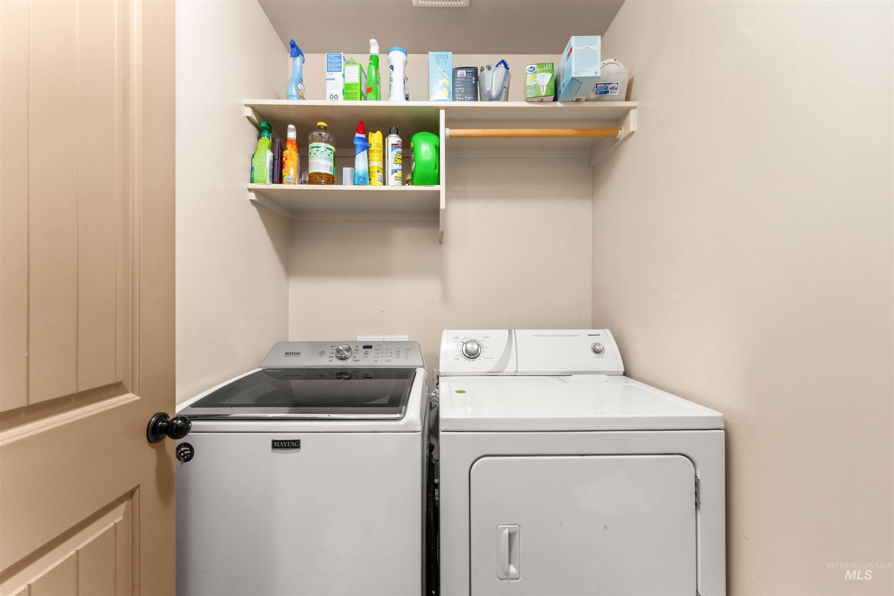 Laundry room with washing machine and dryer