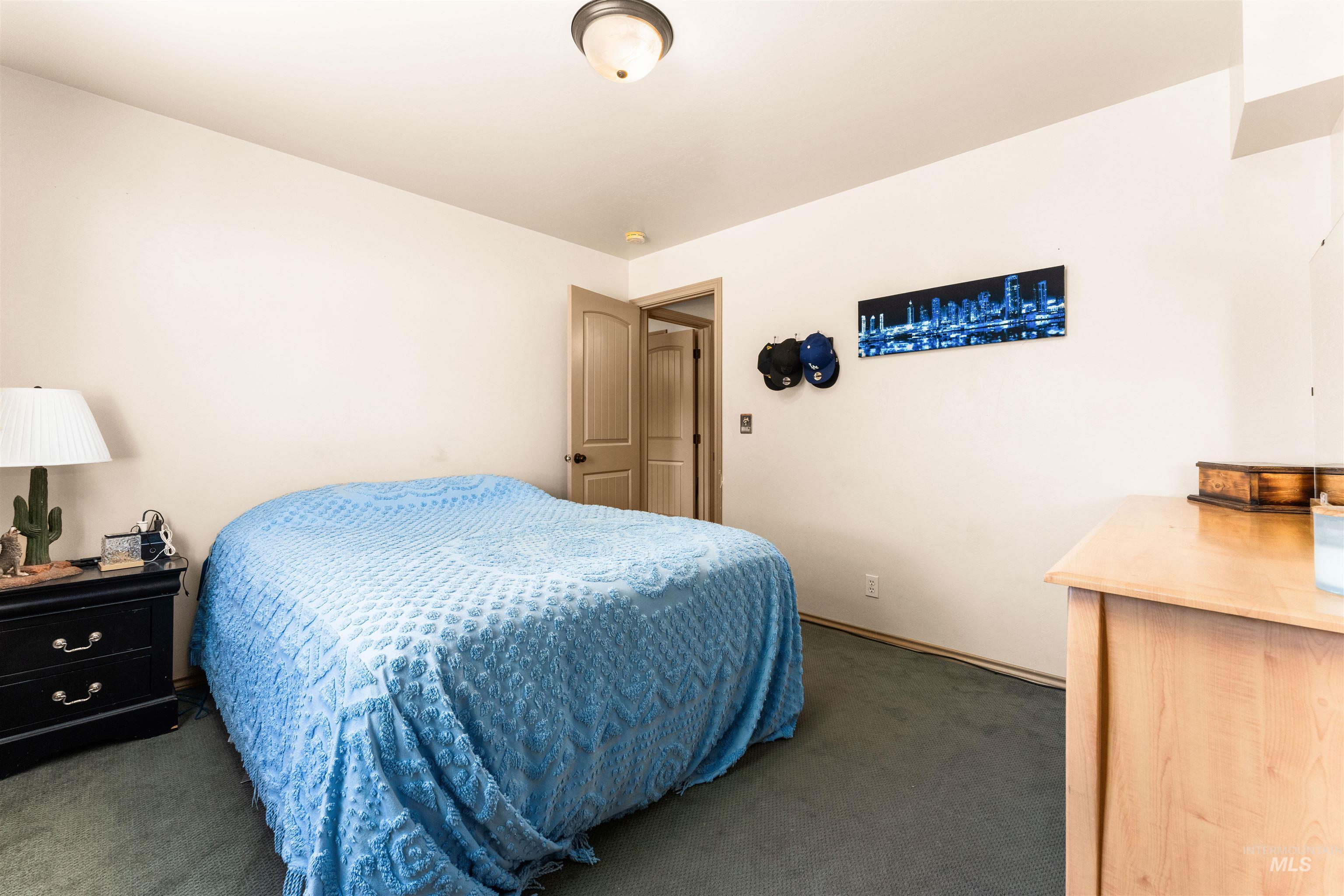 Carpeted bedroom with baseboards