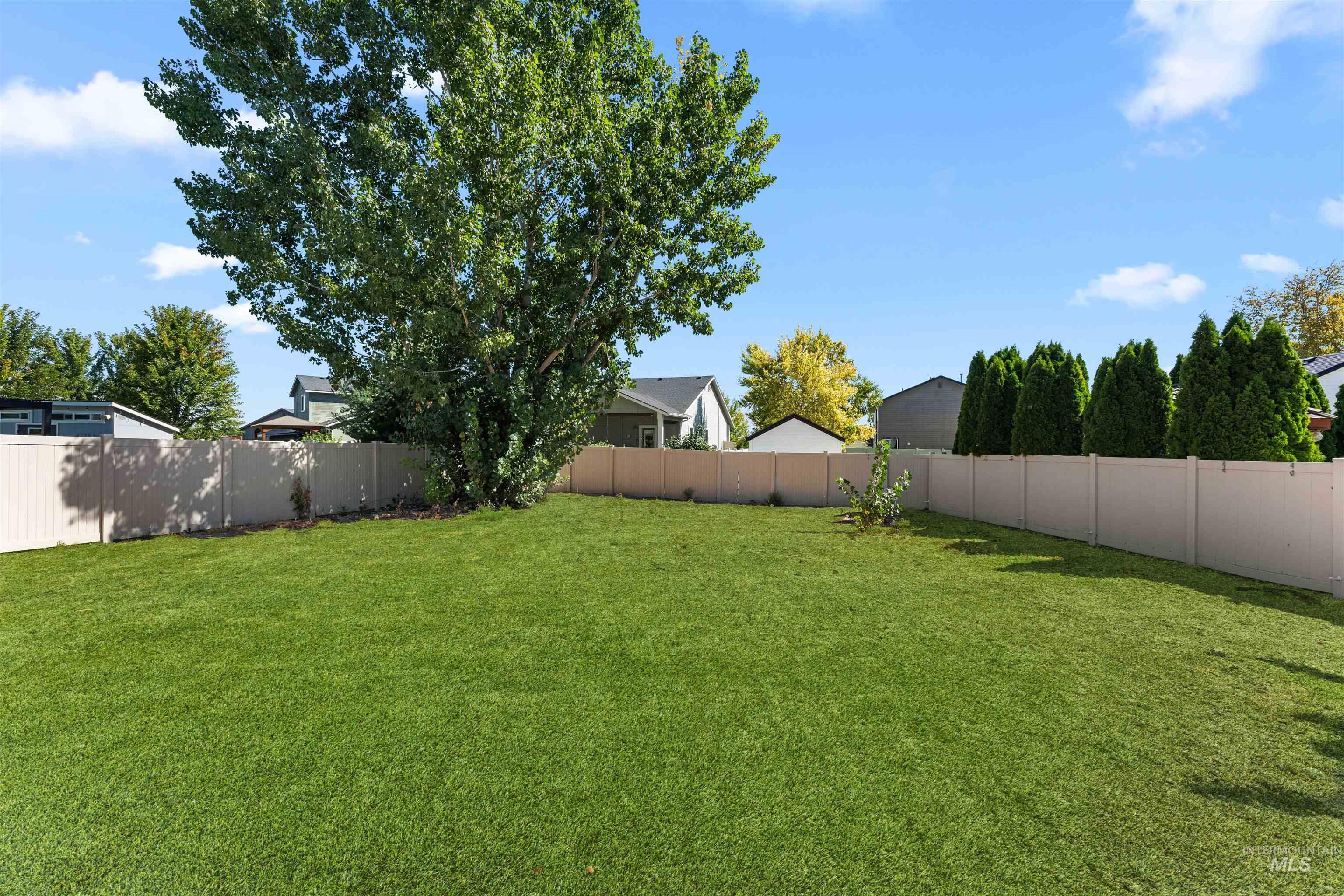 View of fenced backyard