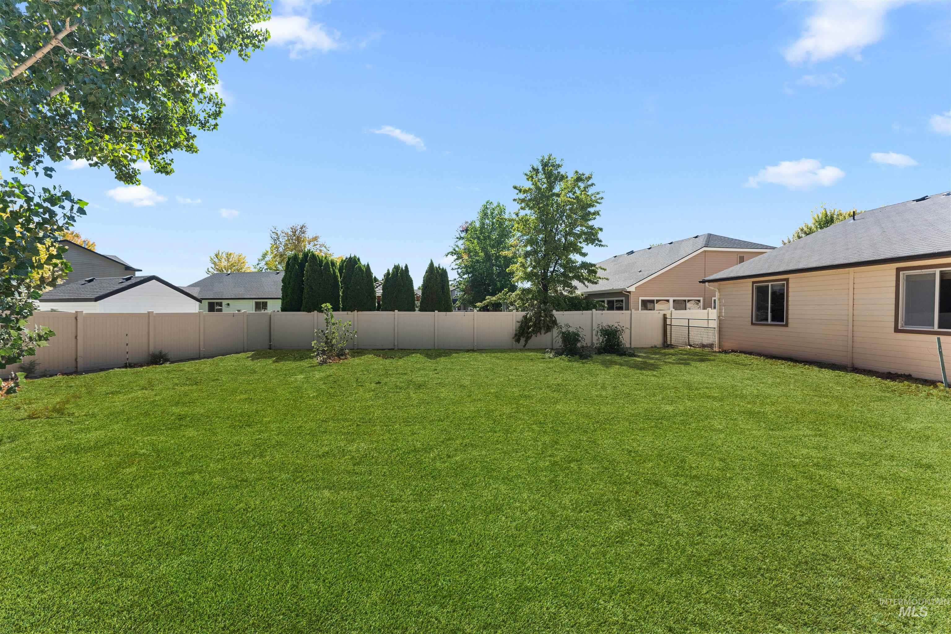 View of fenced backyard