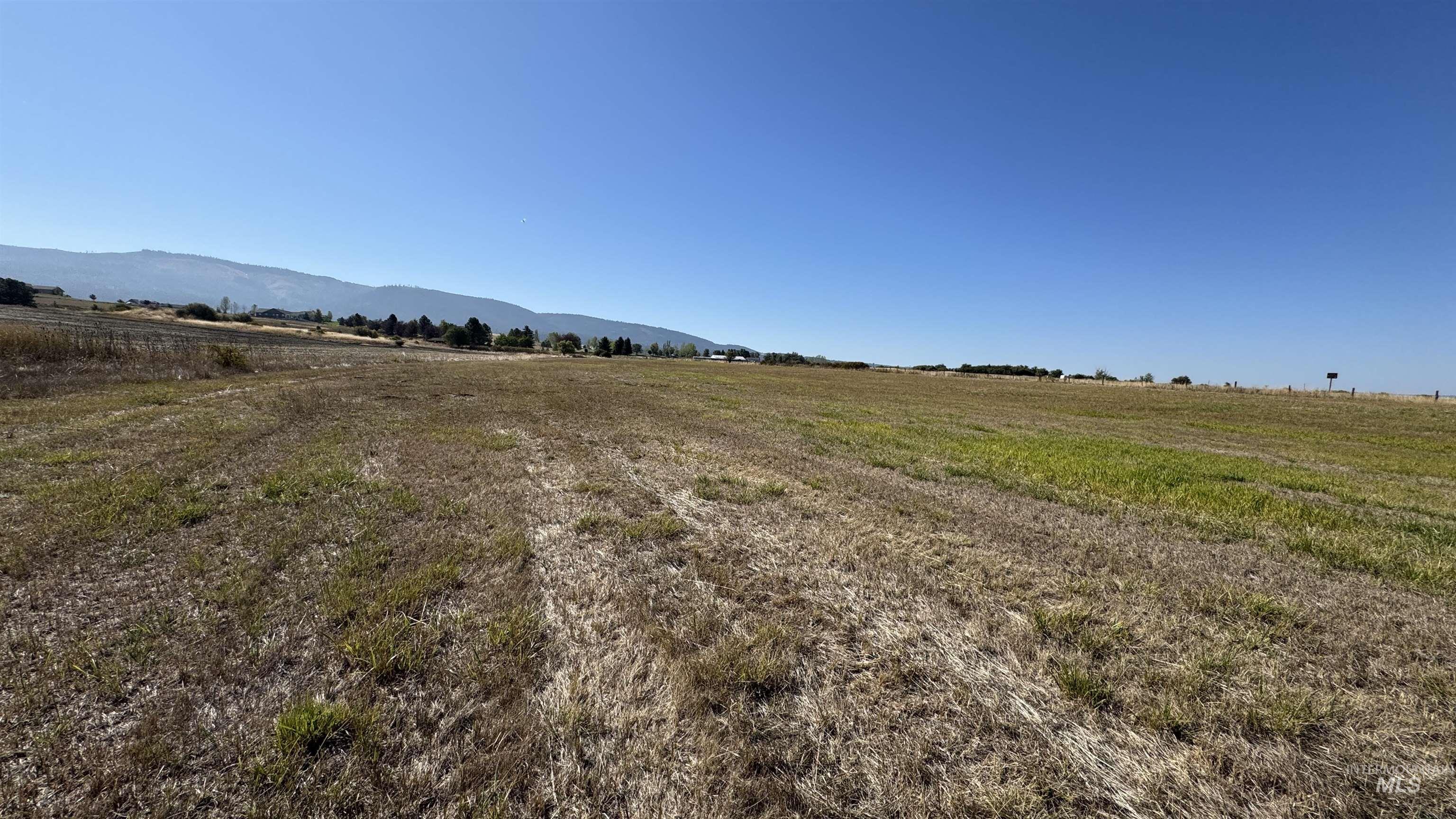 View of yard featuring a view of rural / pastoral area and a mountain view