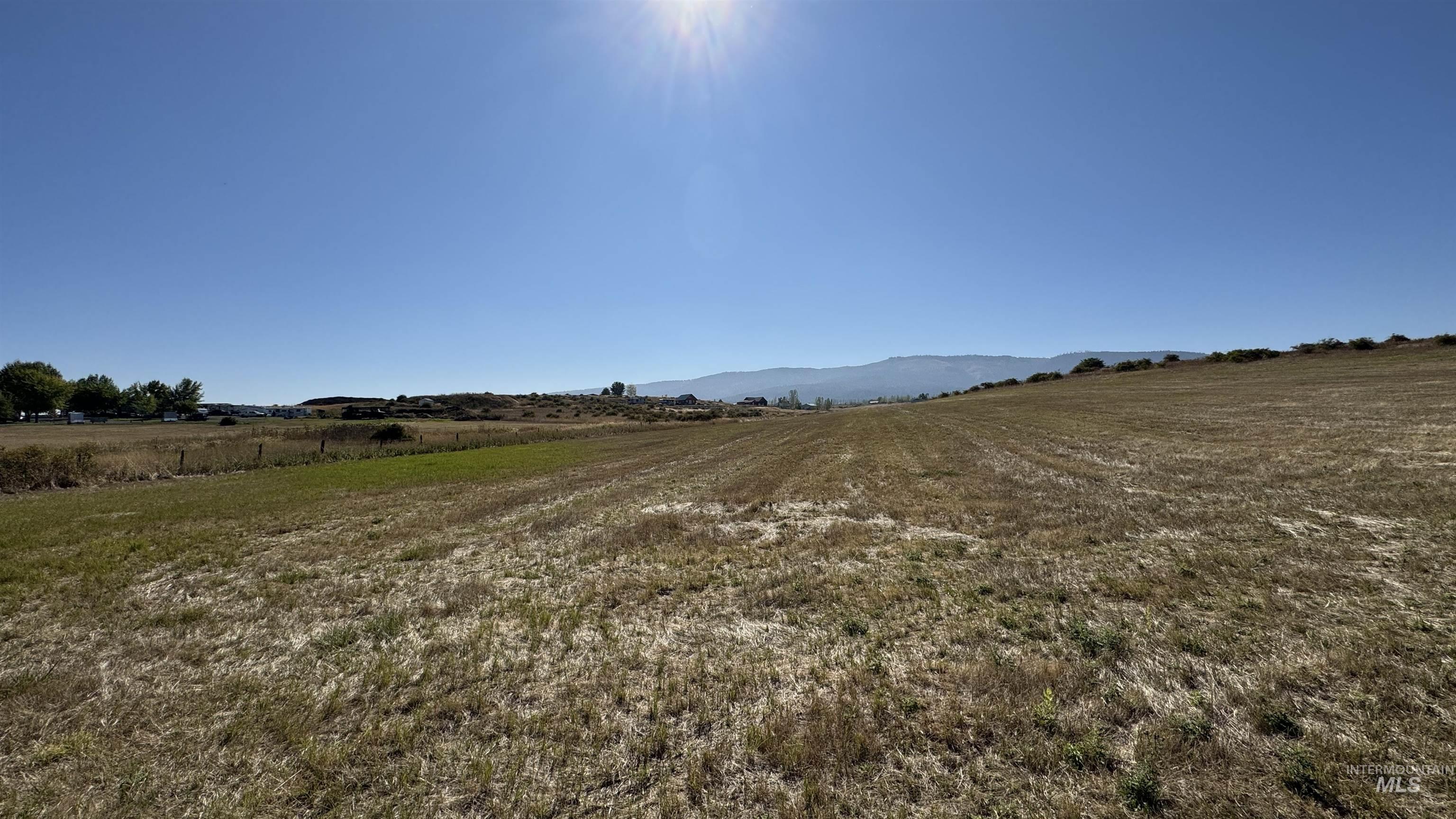 View of yard with a view of countryside and a mountain view