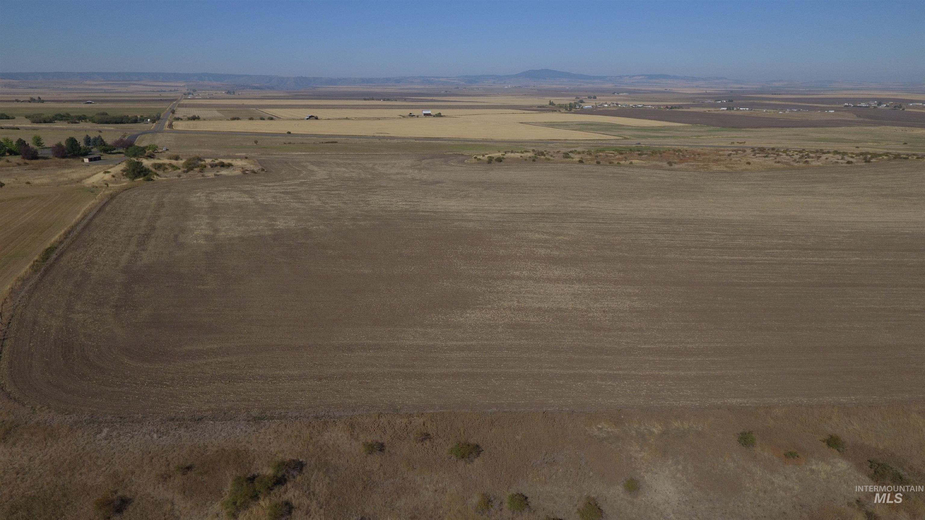 Aerial view of sparsely populated area featuring a mountainous background