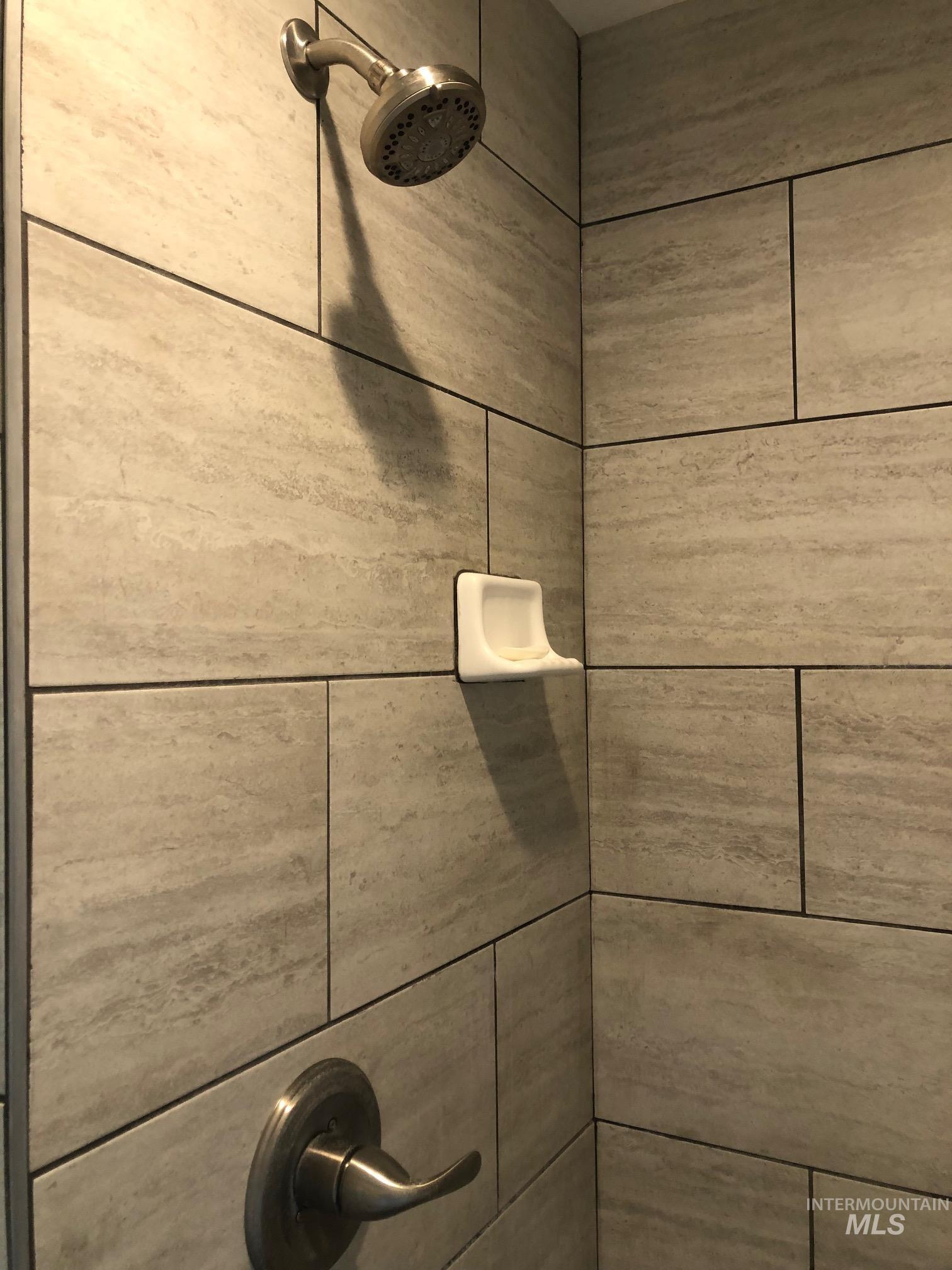 Bathroom view of tiled shower