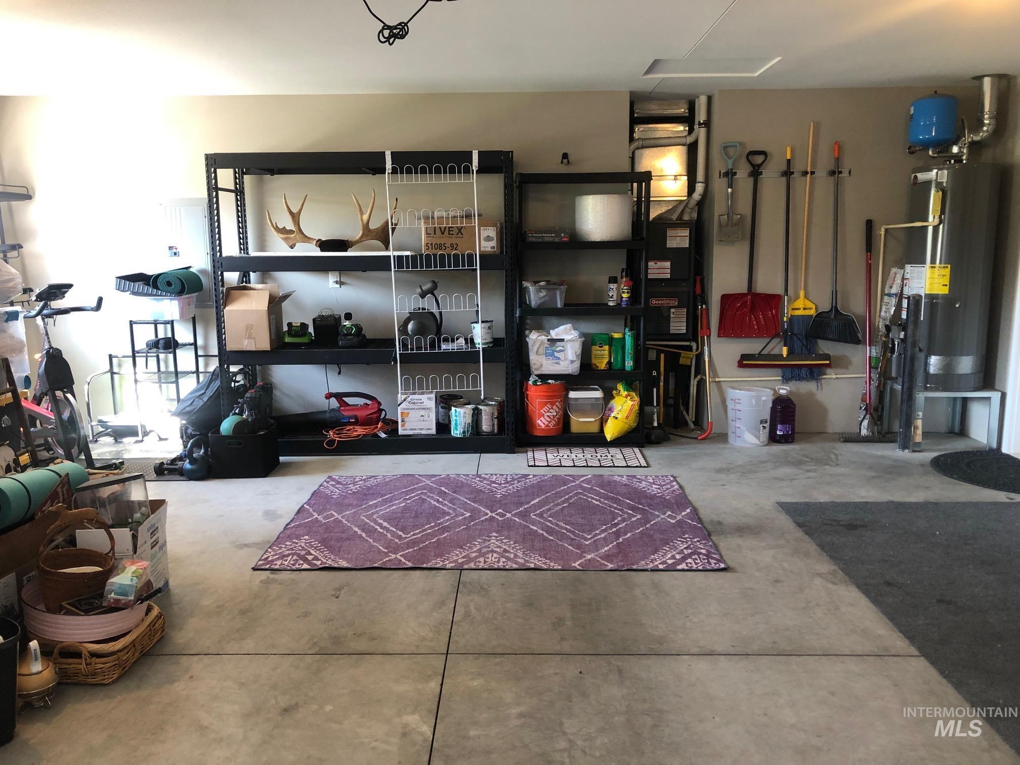 Garage featuring water heater