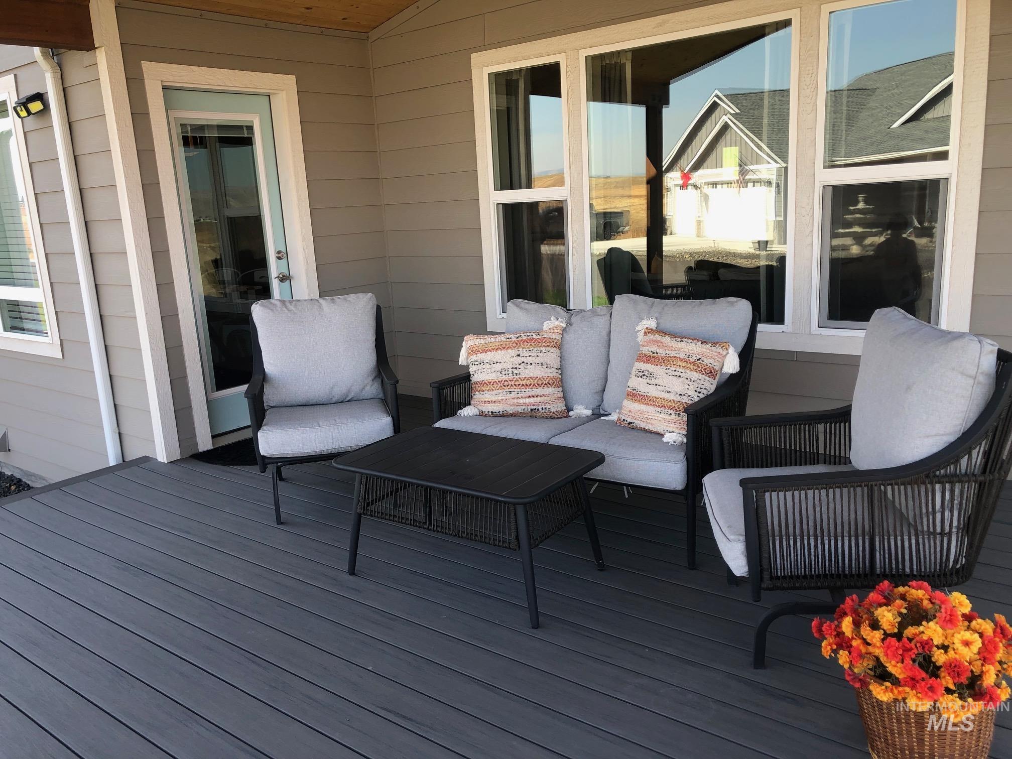 Wooden terrace featuring an outdoor hangout area