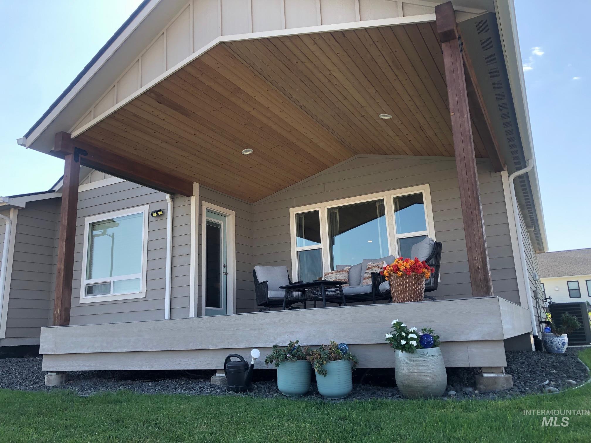Rear view of house with an outdoor living space