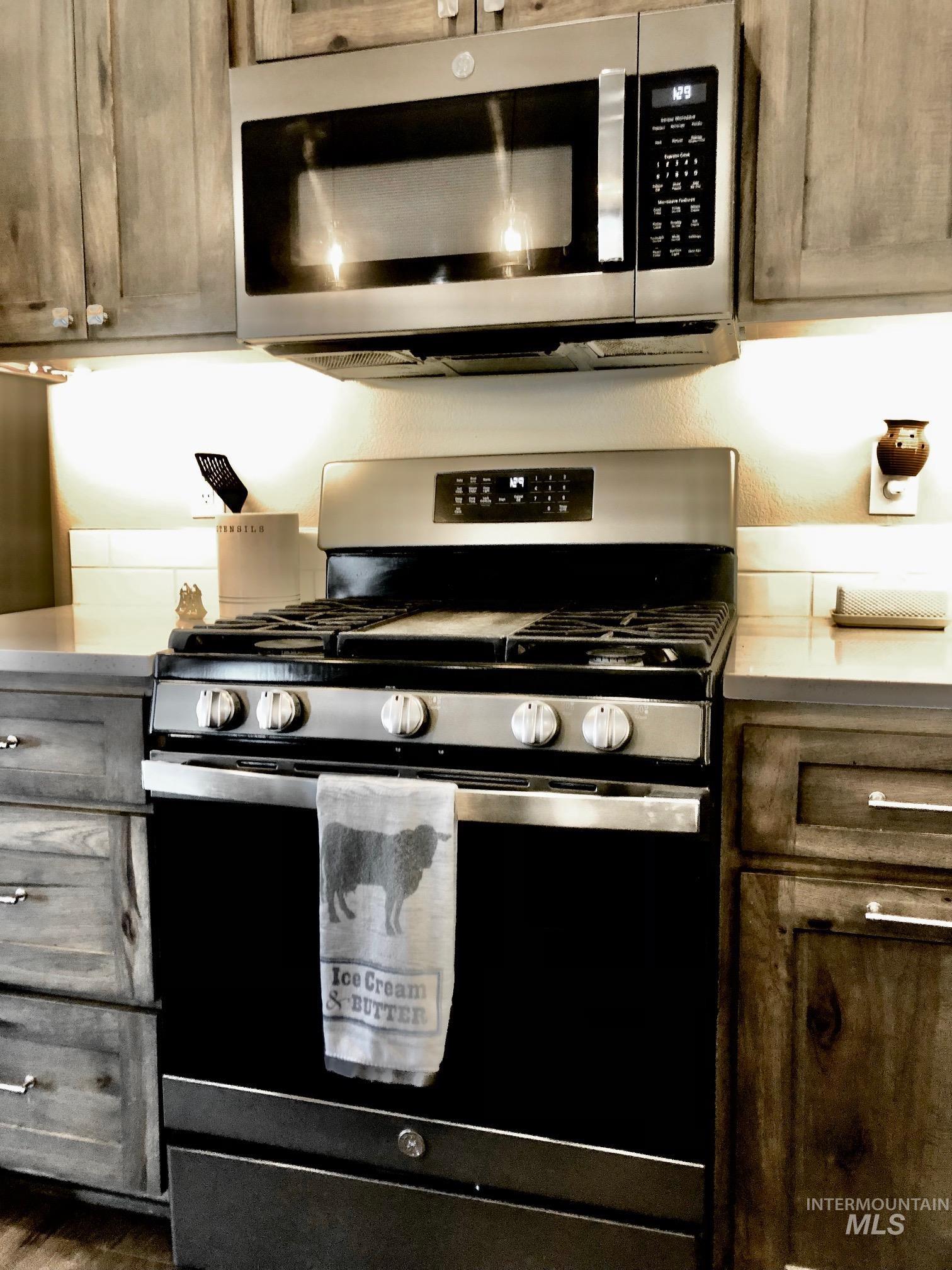 Kitchen featuring appliances with stainless steel finishes