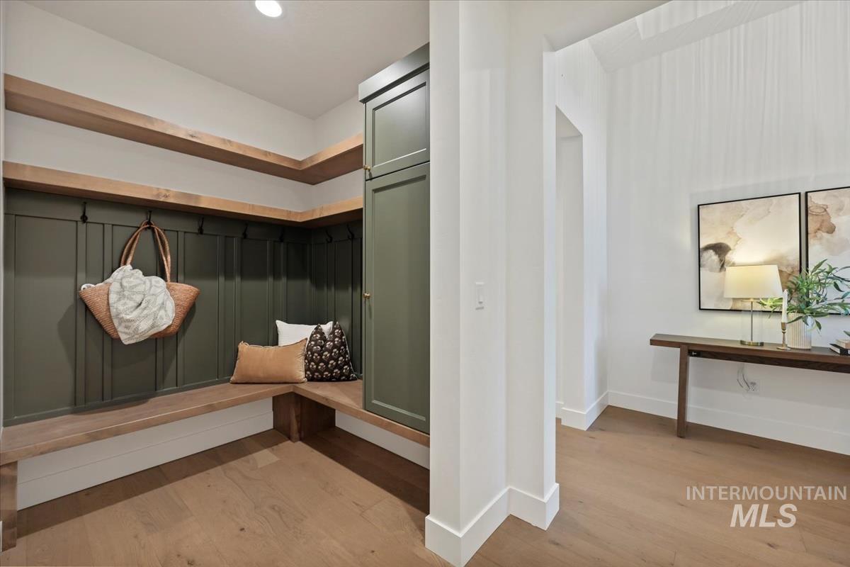 Mudroom with light wood-style flooring and recessed lighting