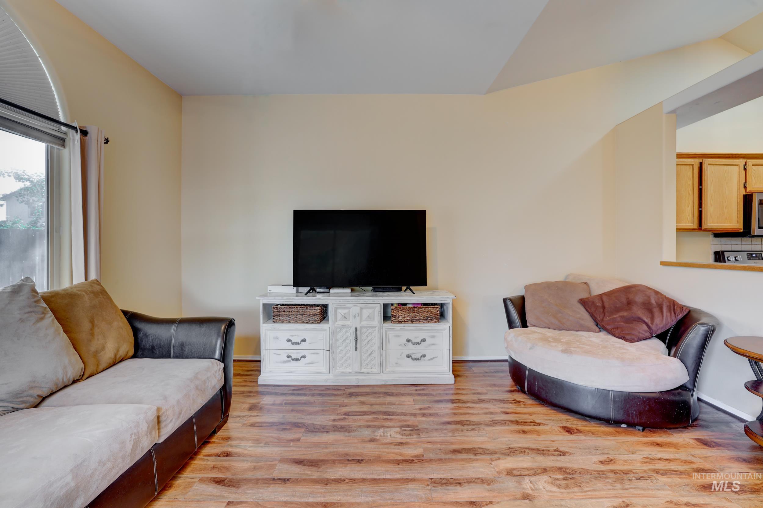 Living area with light wood finished floors