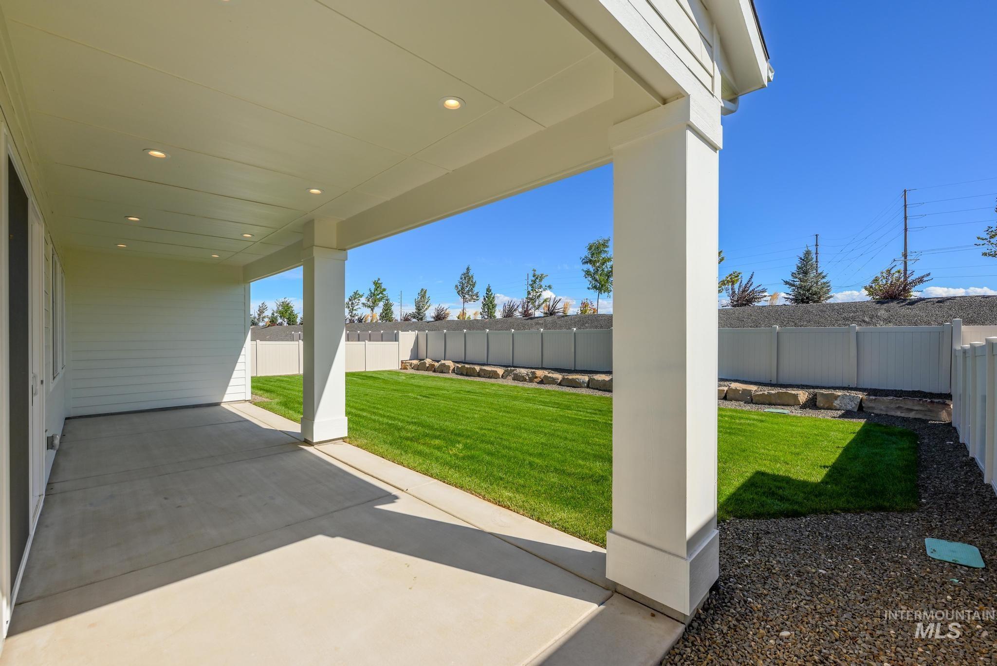 Fenced backyard featuring a patio area