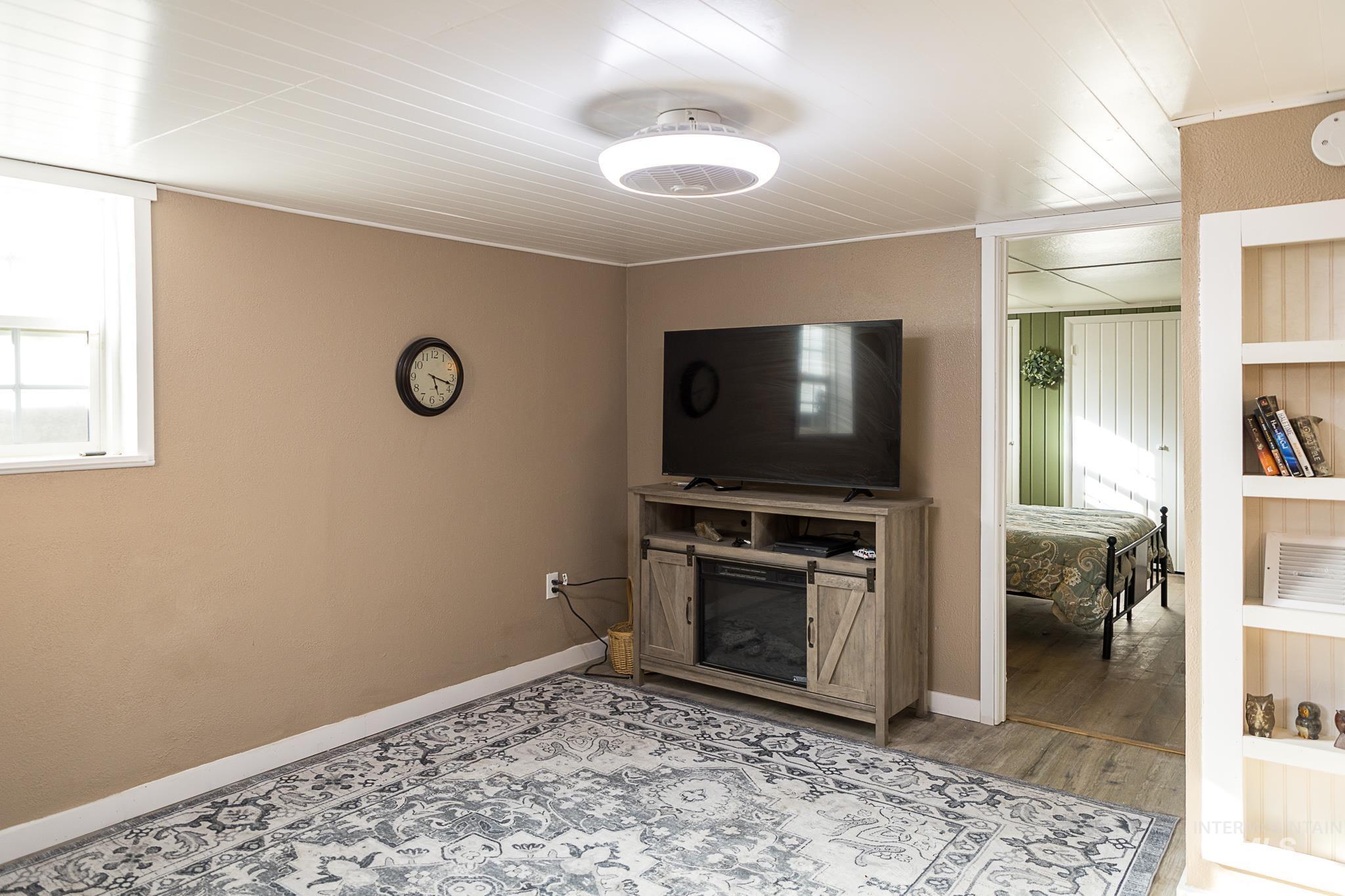 Living area featuring wood finished floors and baseboards