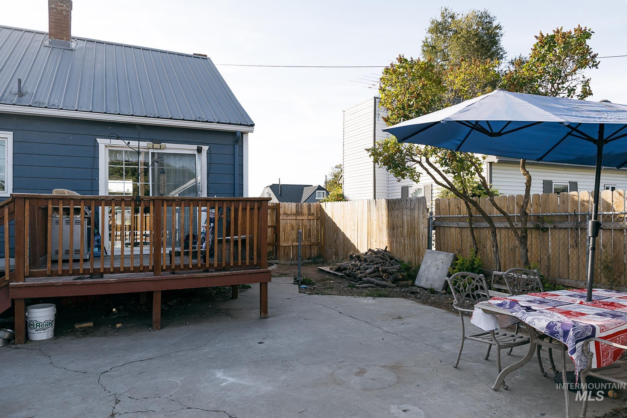 View of patio with a wooden deck